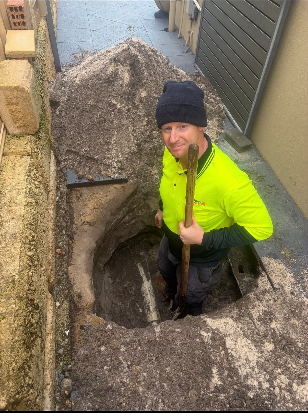 Cliff from Merit Plumbing & Gas on the job in his hi-vis
